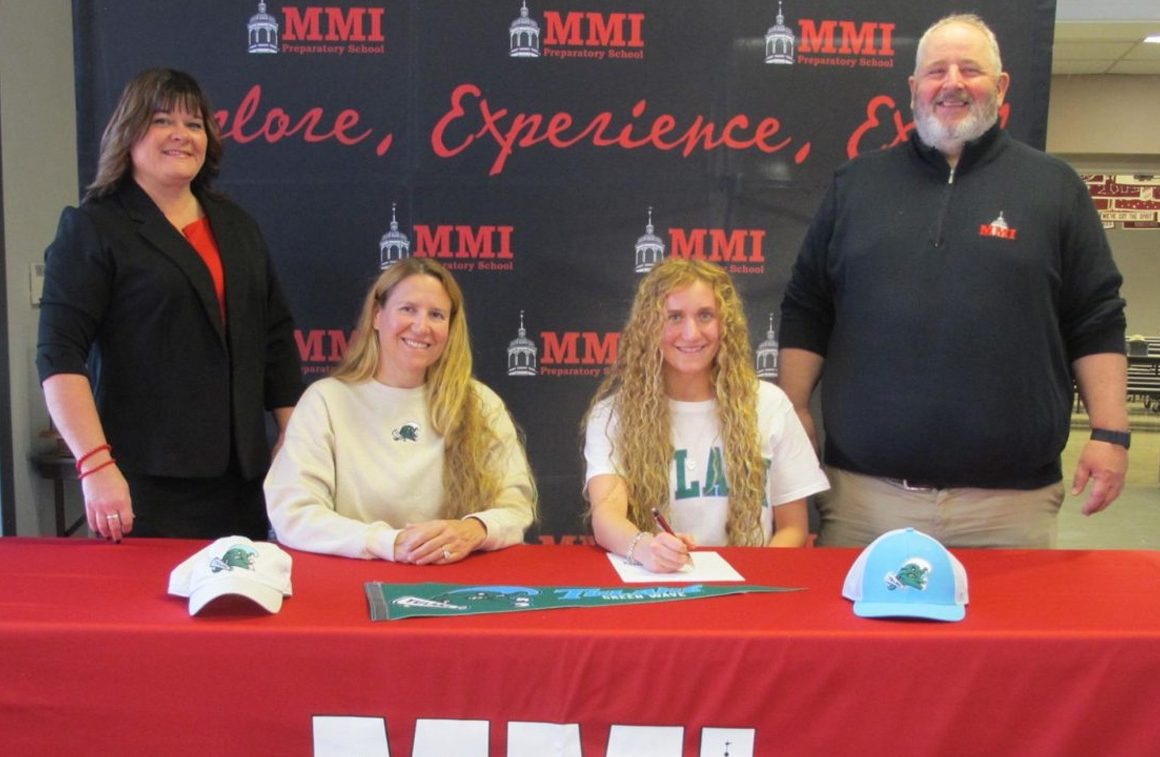 MMI’s Mary Kate Kupsky Signs With Tulane University - Pictured, front row left to right: Lori Blue, Mary Kate’s mother and MMI swim coach, and Mary Kate Kupsky. Back row, left to right: Marci Hosier, Assistant Head of School, and Joseph Flanagan, MMI’s Athletic Director.